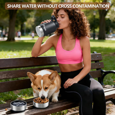 Dog owner sharing water with small dog during outdoor hike