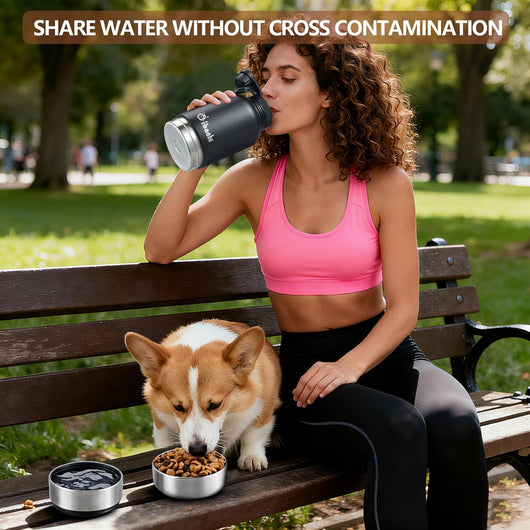 Dog owner sharing water with small dog during outdoor hike