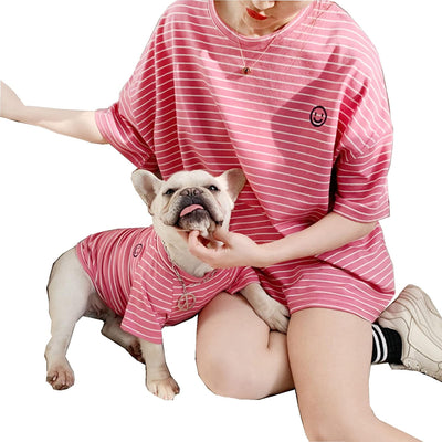 dog wearing pink striped cotton matching shirt